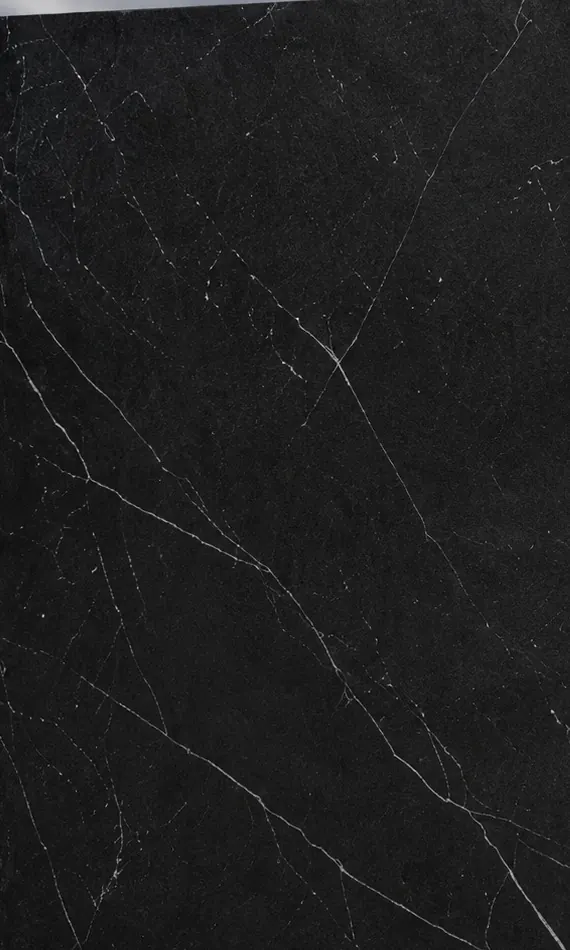 Black marble-look porcelain slab face with fine white veining